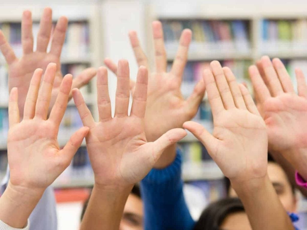 classroom procedures examples - kids hands raised high