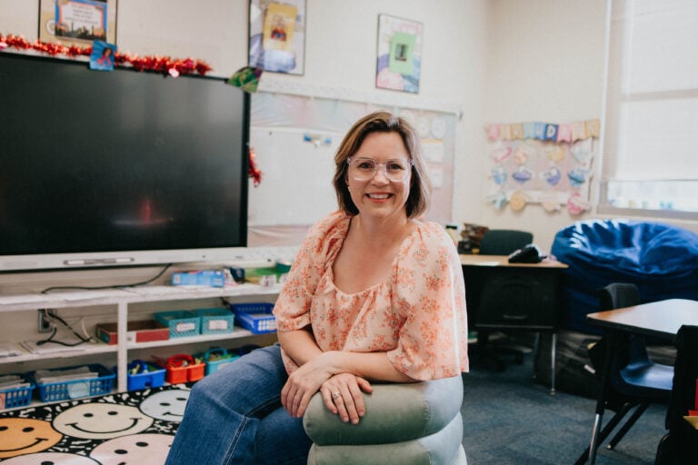 Teacher sitting in comfy classroom chair